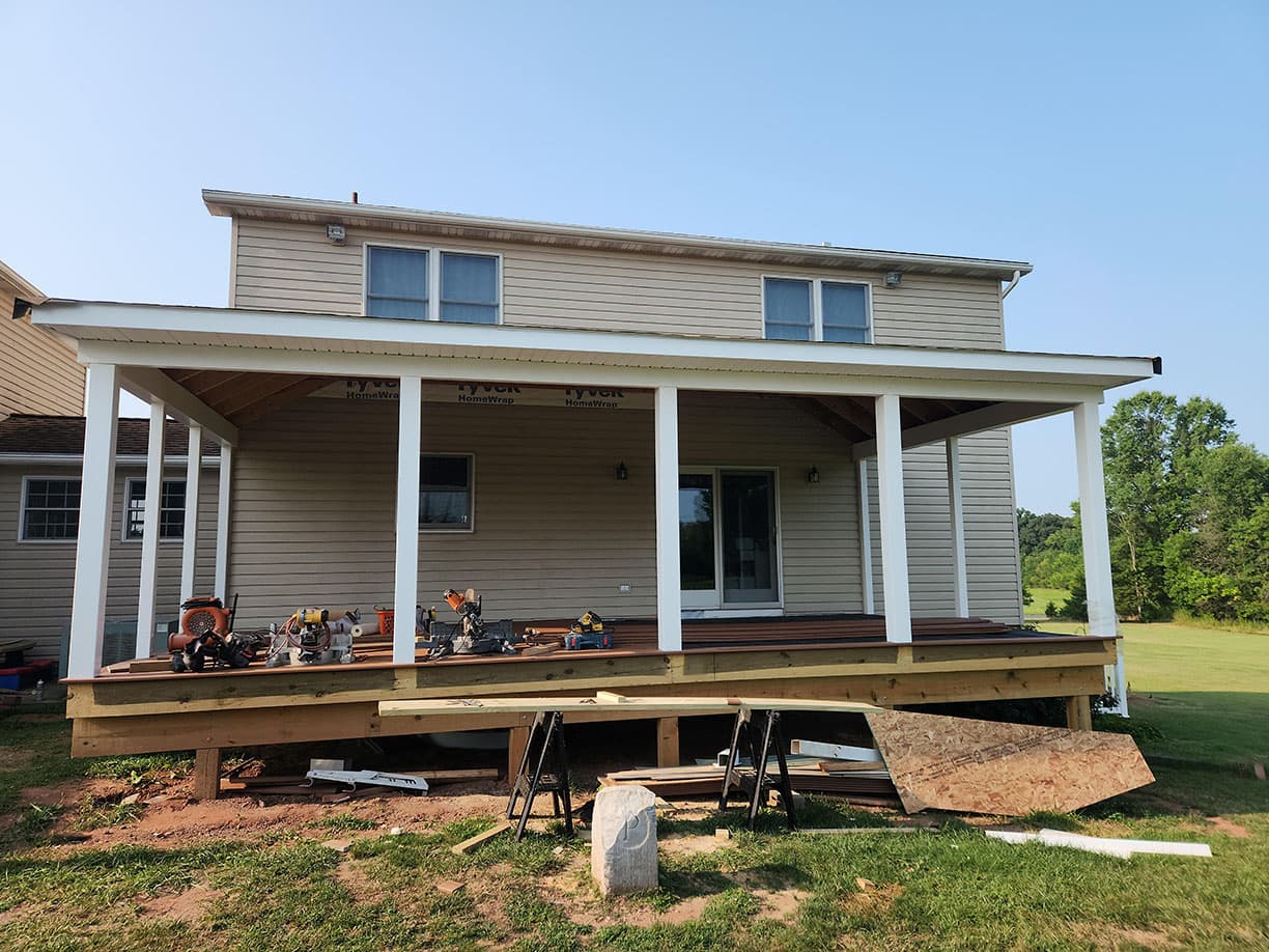 Covered porch with new decking under construction